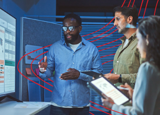 Three professionals study financial data on a large digital screen, analyzing trends in a technology-driven environment.