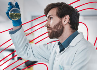 Researcher examining a liquid sample in a laboratory flask under bright lab lighting.