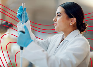 Laboratory professional using a pipette to conduct testing in a clinical lab.