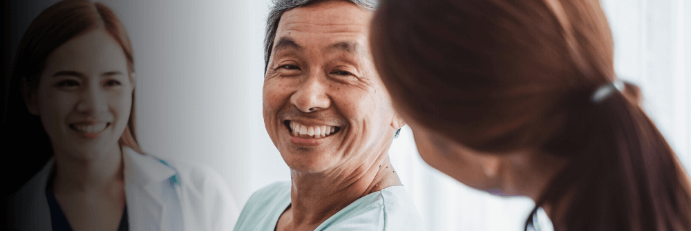 Cancer registry professionals speaking with a patient.