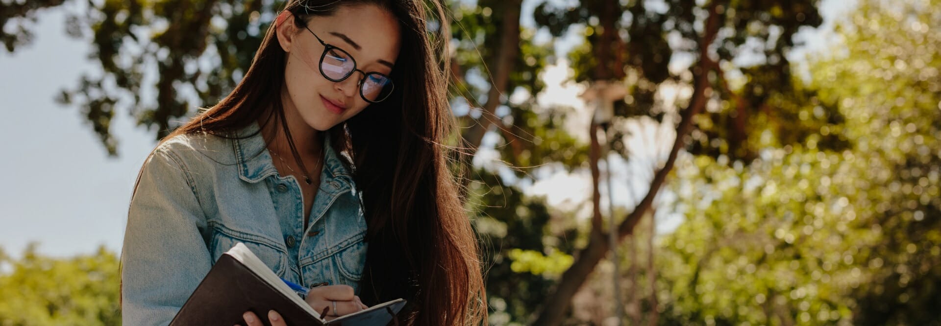 Interdisciplinary Studies student writing in a notebook.