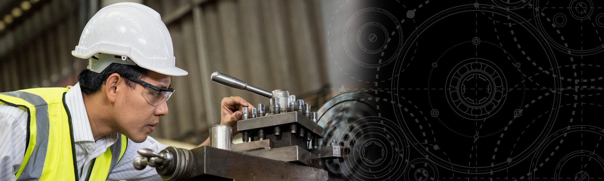 Mechanical engineer wearing a safety helmet and high-visibility vest inspecting machinery in a manufacturing facility.
