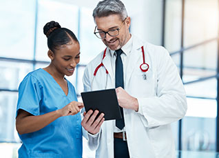 Nurse practitioner performing a checkup with a stethoscope on a young girl patient during a routine wellness visit in a clinic.