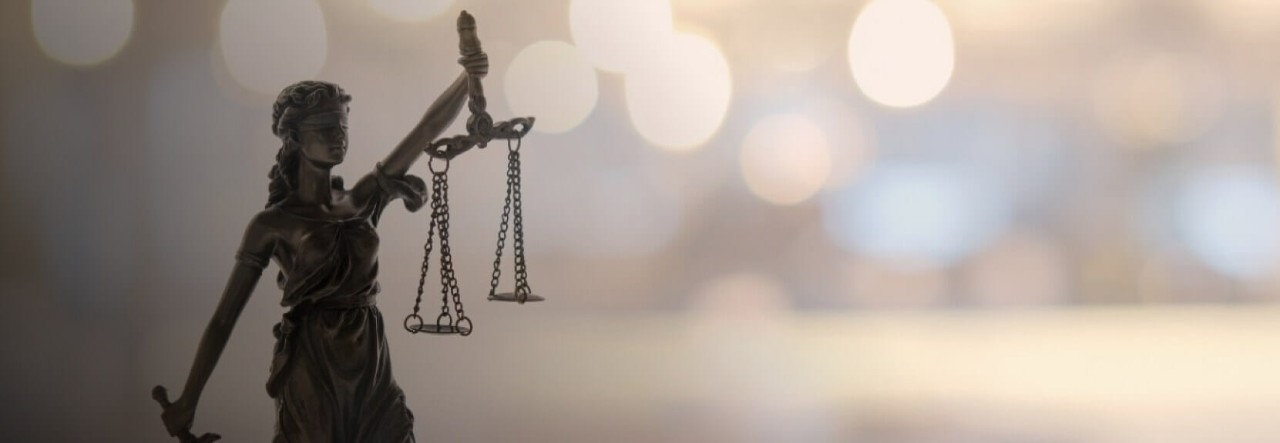 Statue of Lady Justice symbolizing law and balance.