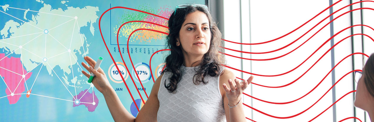 Geographic information systems expert studying terrain map.