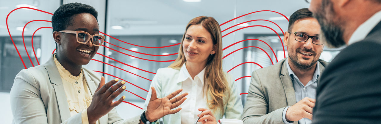 Four communication professionals in a meeting.