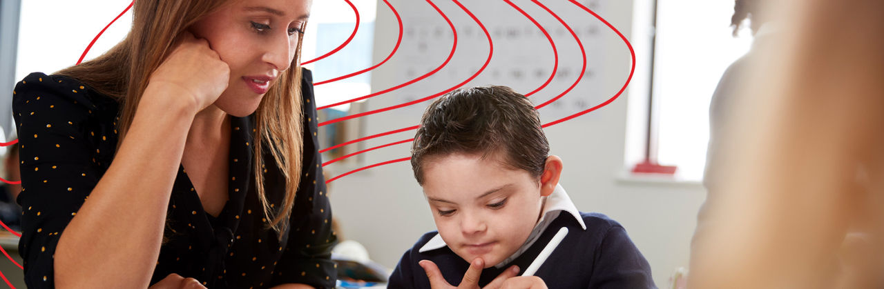 Teacher working with young child with special education needs