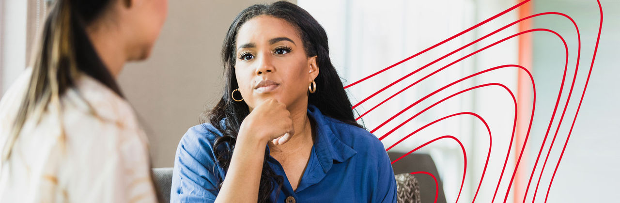 Social work graduate working with a family of four: a mom and dad and their two children.