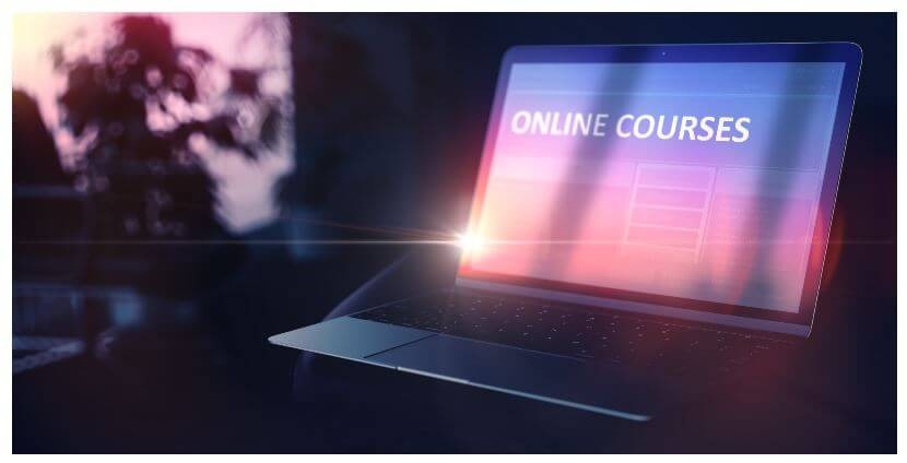 Image of an open laptop with "ONLINE COURSES" displayed on the screen.