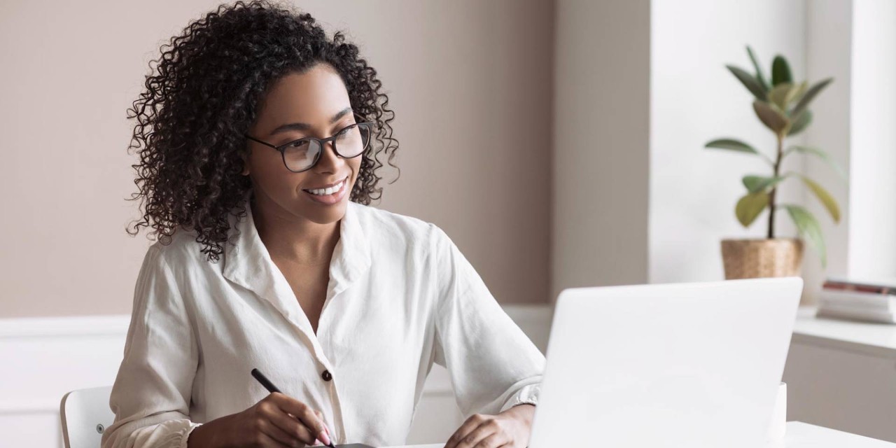 Freelancer woman working on laptop computer at home. Creative occupation, work from home, freelance, online learning, lockdown, studying concept. Distance education